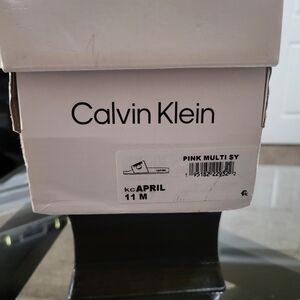 Calvin Klein iridescent slides.